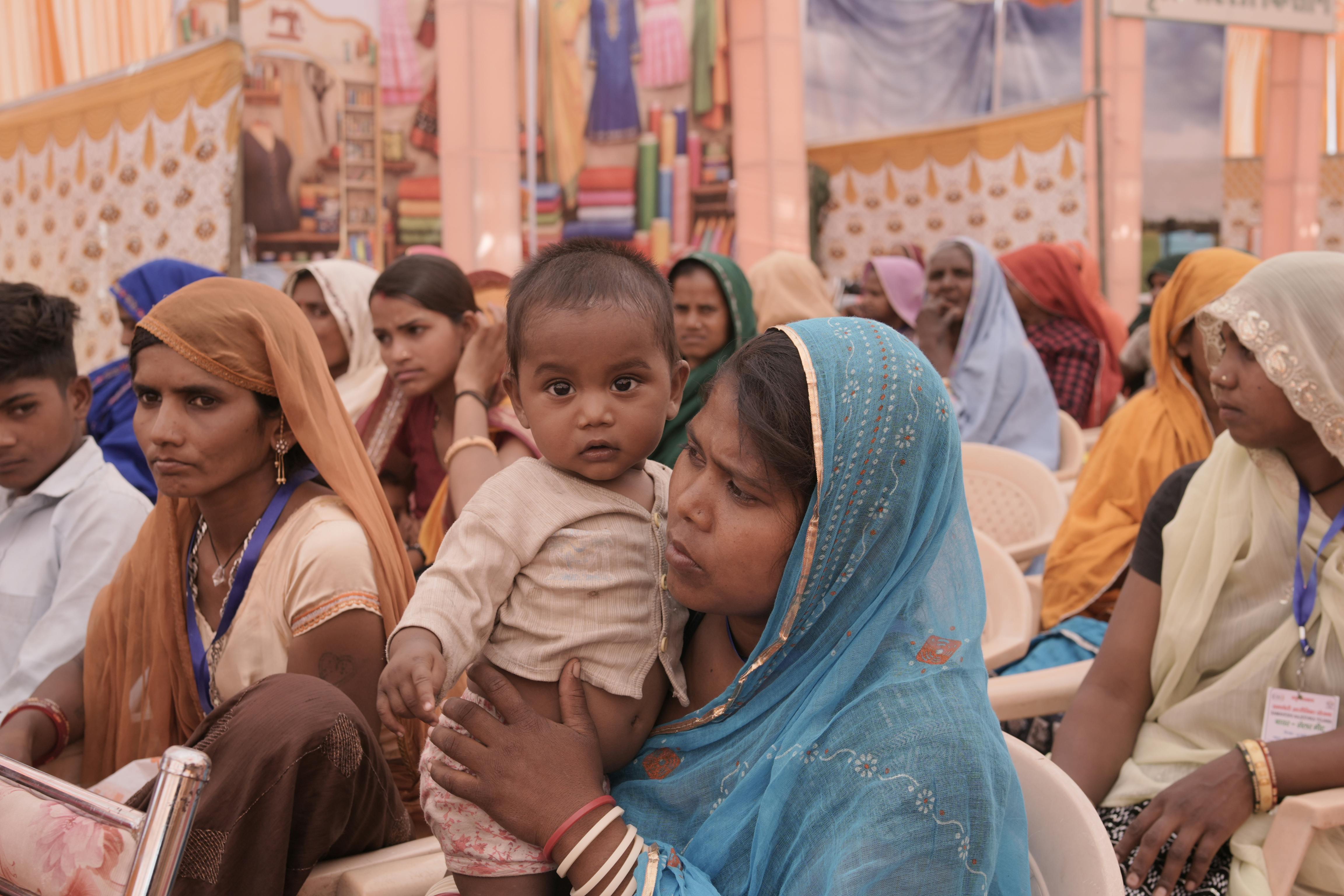 Volunteers and medical staff providing healthcare support during a community health camp
